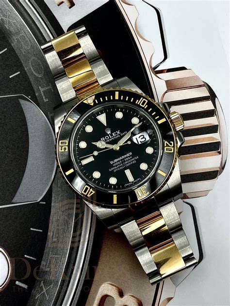 black rolex silver band|Rolex submariner black and gold.